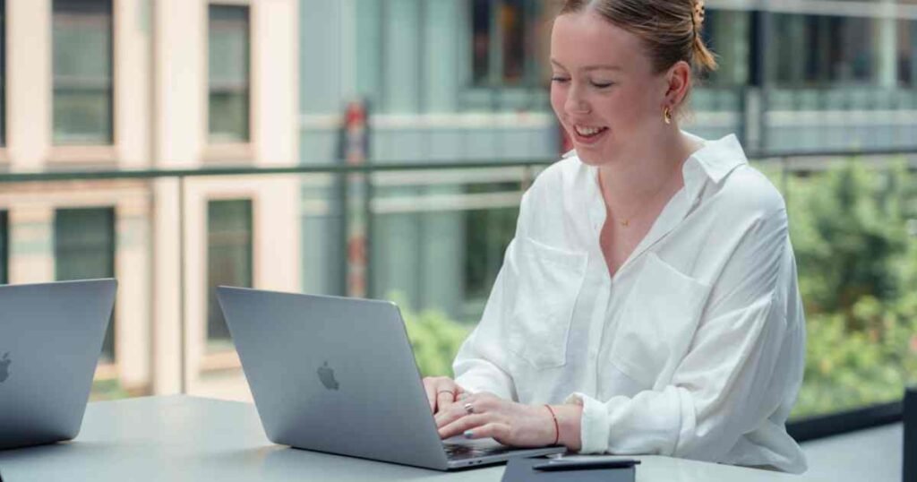 A female professional using a contest management system to boost participant engagement through automated features like live voting and social media integration